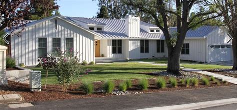 ranch style house vertical metal siding|raised ranch with vertical siding.